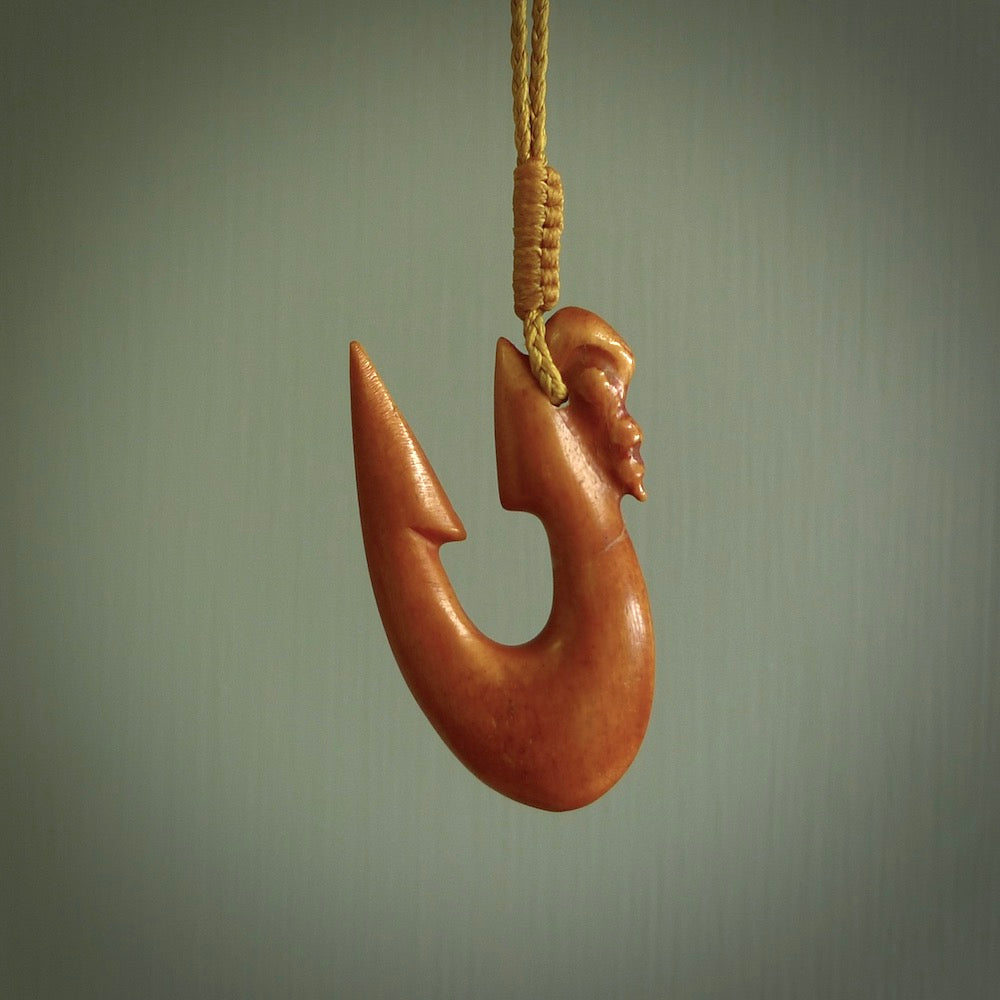 HAND CARVED NATURAL STAINED BONE MANAIA WITH HOOK PENDANT ONE ONLY