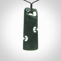 This is a beautiful large New Zealand Jade, pounamu Manaia Toki pendant with double Koru and Paua Shell eyes. Hand carved for us by Kyohei Noguchi. It is bound with an adjustable black coloured cord which is length adjustable. Free worldwide shipping. We have one only.