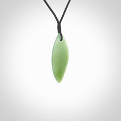 One only small sized New Zealand Inanga jade drop pendant. Hand carved in New Zealand by Ric Moor, jade artist, for NZ Pacific. Provided with adjustable black cord.