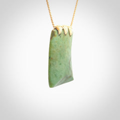 This is a lovely New Zealand Jade, pounamu drop pendant. Hand carved for us by Ric Moor. It is bound with an adjustable beige coloured cord which is length adjustable. Free worldwide shipping.