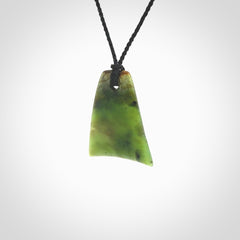 This is a lovely New Zealand Jade, pounamu drop pendant. Hand carved for us by Ric Moor. It is bound with an adjustable black coloured cord which is length adjustable. Free worldwide shipping.