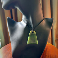 This is a lovely New Zealand Jade, pounamu drop pendant. Hand carved for us by Ric Moor. It is bound with an adjustable black coloured cord which is length adjustable. Free worldwide shipping.