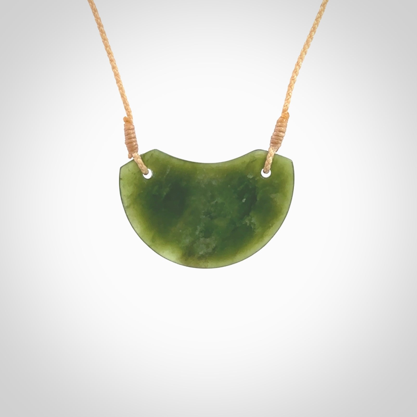 Hand carved pounamu small shield drop pendant. Jade necklace hand made in New Zealand. A contemporary drop pendant carved from rare New Zealand jade. NZ Pacific jade jewellery for sale online.