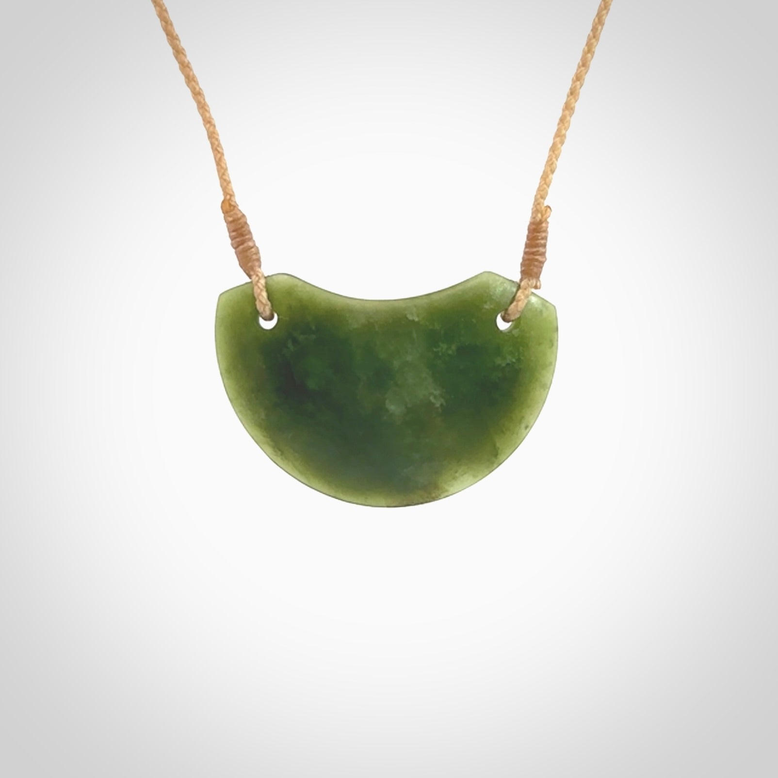 Hand carved pounamu small shield drop pendant. Jade necklace hand made in New Zealand. A contemporary drop pendant carved from rare New Zealand jade. NZ Pacific jade jewellery for sale online.