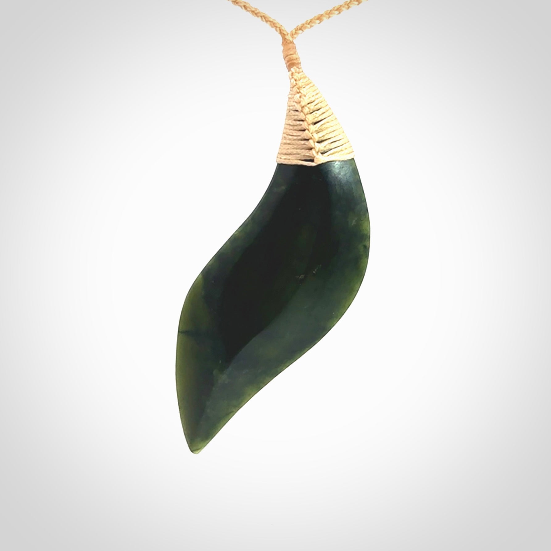 One only large sized New Zealand jade drop pendant. Hand carved in New Zealand by Ric Moor, jade artist, for NZ Pacific. Contemporary drop necklace with adjustable beige cord, packaged in a woven kete pouch.