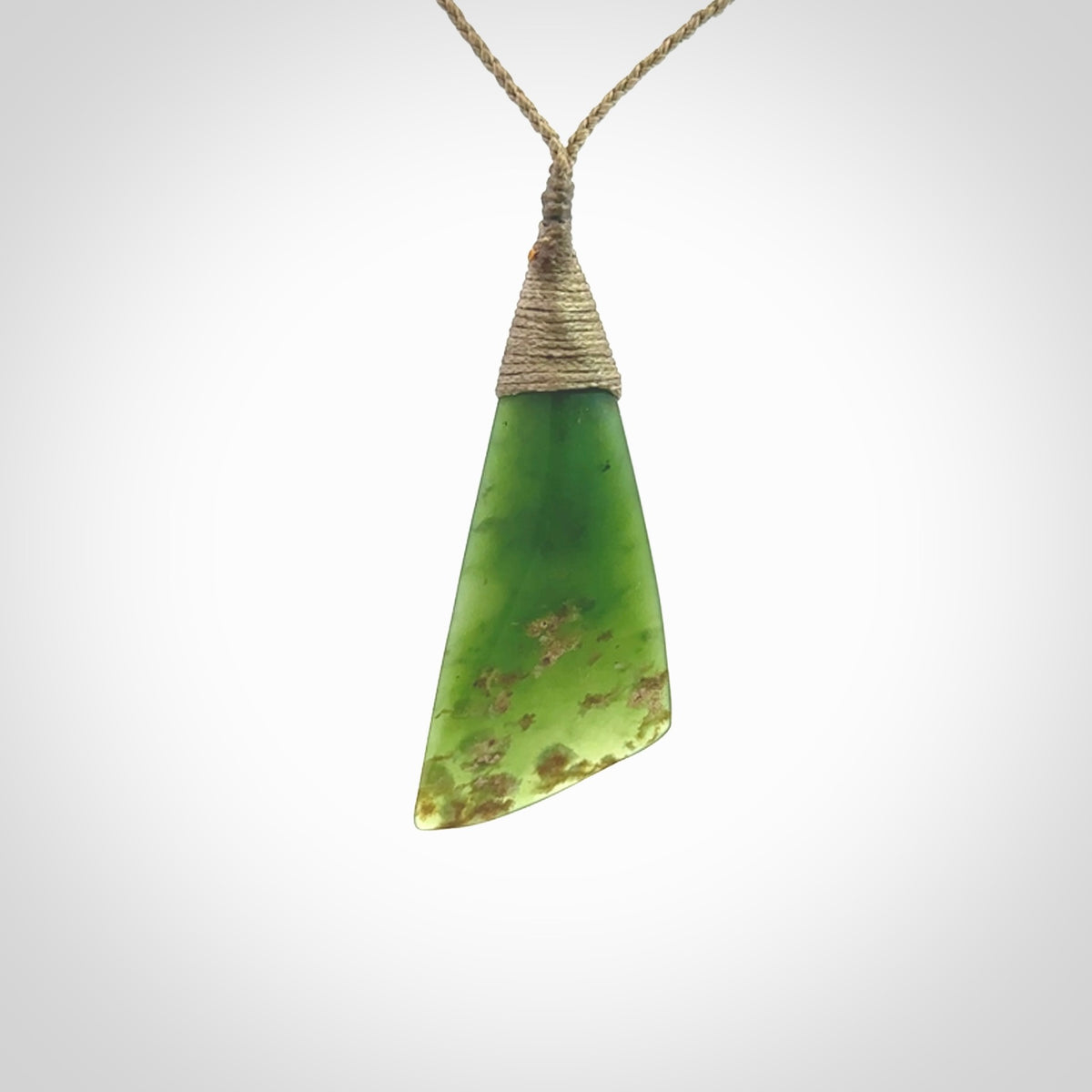 One only medium sized New Zealand jade drop pendant. Hand carved in New Zealand by Ric Moor, jade artist, for NZ Pacific.