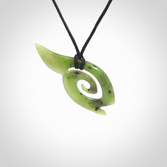 This photo shows a koru pendant carved from New Zealand Jade. The artist, Shaun Gardiner, has carved this beautifully. We provide this piece with an adjustable black cord. This is a fantastic work of art, we have one only.