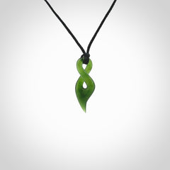 Hand carved small sized, New Zealand jade twist pendant. Carved in New Zealand by NZ Pacific. Hand made small Jade twist with adjustable black cord by Shaun Gardiner.