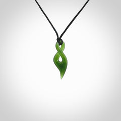 Hand carved small sized, New Zealand jade twist pendant. Carved in New Zealand by NZ Pacific. Hand made small Jade twist with adjustable black cord by Shaun Gardiner.