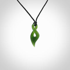 Hand carved small sized, New Zealand jade twist pendant. Carved in New Zealand by NZ Pacific. Hand made small Jade twist with adjustable black cord by Shaun Gardiner.