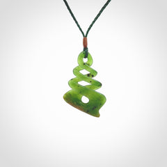 This is a striking, medium sized, twist pendant carved in New Zealand jade by Shaun Gardiner. Hand made Jade twist with adjustable green cord.