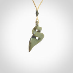 Hand carved New Zealand jade twist pendant. Carved in New Zealand by NZ Pacific. Hand made Jade twist with adjustable oat coloured cord by Shaun Gardiner.