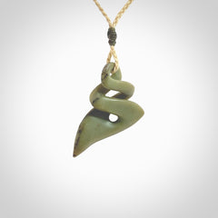 Hand carved New Zealand jade twist pendant. Carved in New Zealand by NZ Pacific. Hand made Jade twist with adjustable oat coloured cord by Shaun Gardiner.