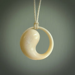 A hand carved masterpiece. A complex contemporary drop pendant carved from bone by Yuri Terenyi for NZ Pacific. This is a true piece of wearable art which is collectible. A one-off masterpiece and quite unique. Delivered with adjustable ice white necklace cord.