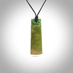 Hand made New Zealand jade Toki drop pendant. Hand carved in New Zealand by Levi Lewis. Hand made jewellery. Unique large Jade drop with fixed length black coloured cord. Free shipping worldwide.