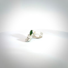 This is a handcrafted New Zealand Pounamu, Jade and sterling silver ring. This is a solid little work of art. We ship this worldwide for free and are happy to answer any questions that you may have about these or other products on our website.