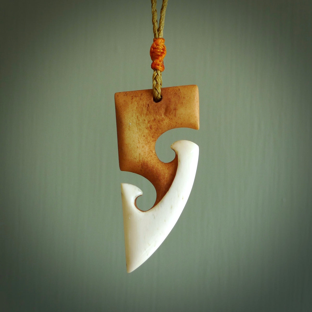 HAND CARVED NATURAL BONE TOKI WITH TWO KORU PENDANT. STAINED BONE ART ...