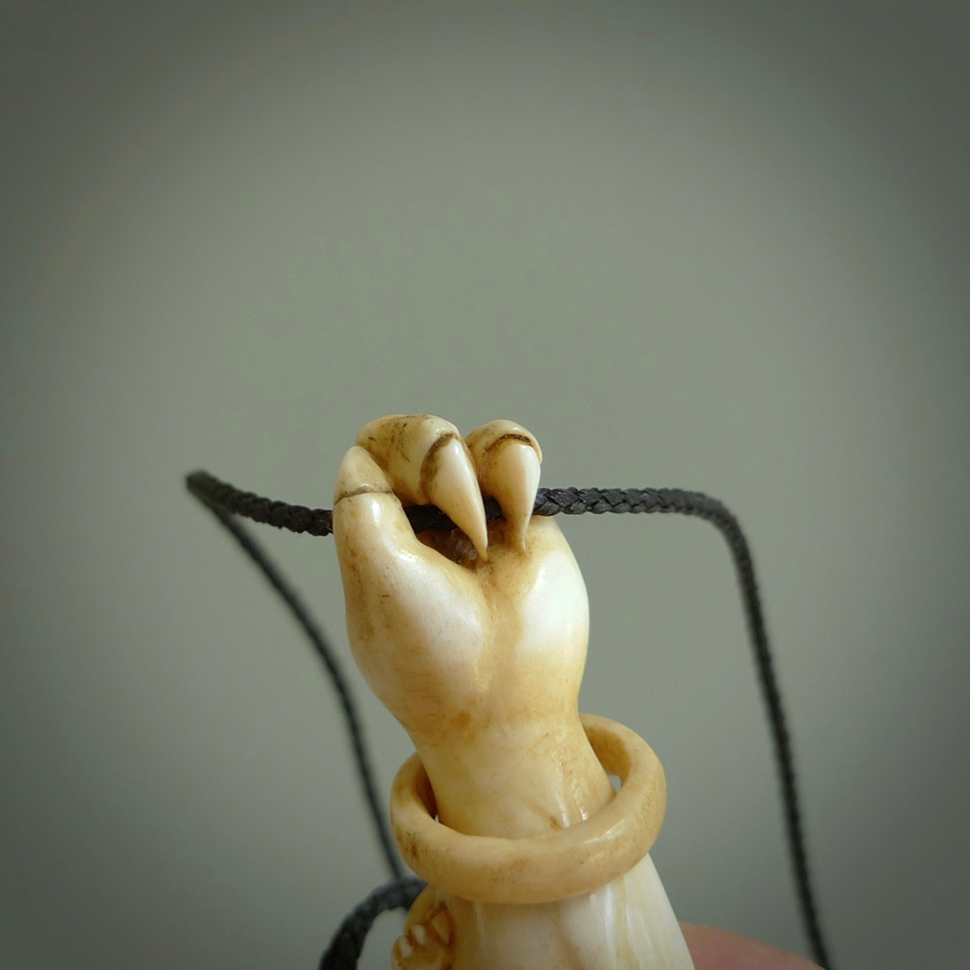 Hand carved Rashōmon Pendant. Made from Red Deer antler in New Zealand. Unique Japanese necklace hand made from deer antler by master bone carver Fumio Noguchi. Spectacular collectable work of art, made to wear. One only pendant, delivered to you at no extra cost with express courier.