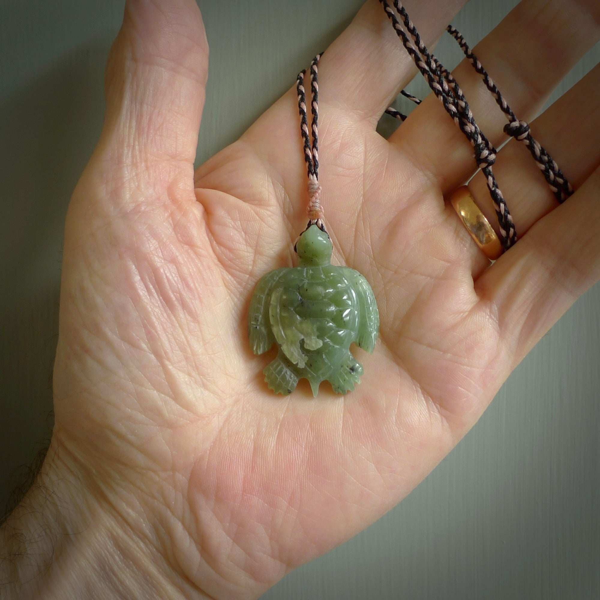 Nephrite jade turtle pendant. Hand carved jade turtle pendant, made by NZ Pacific for sale online. Unique handmade jewellery. Provided with an adjustable cord and packaged in a woven kete pouch.