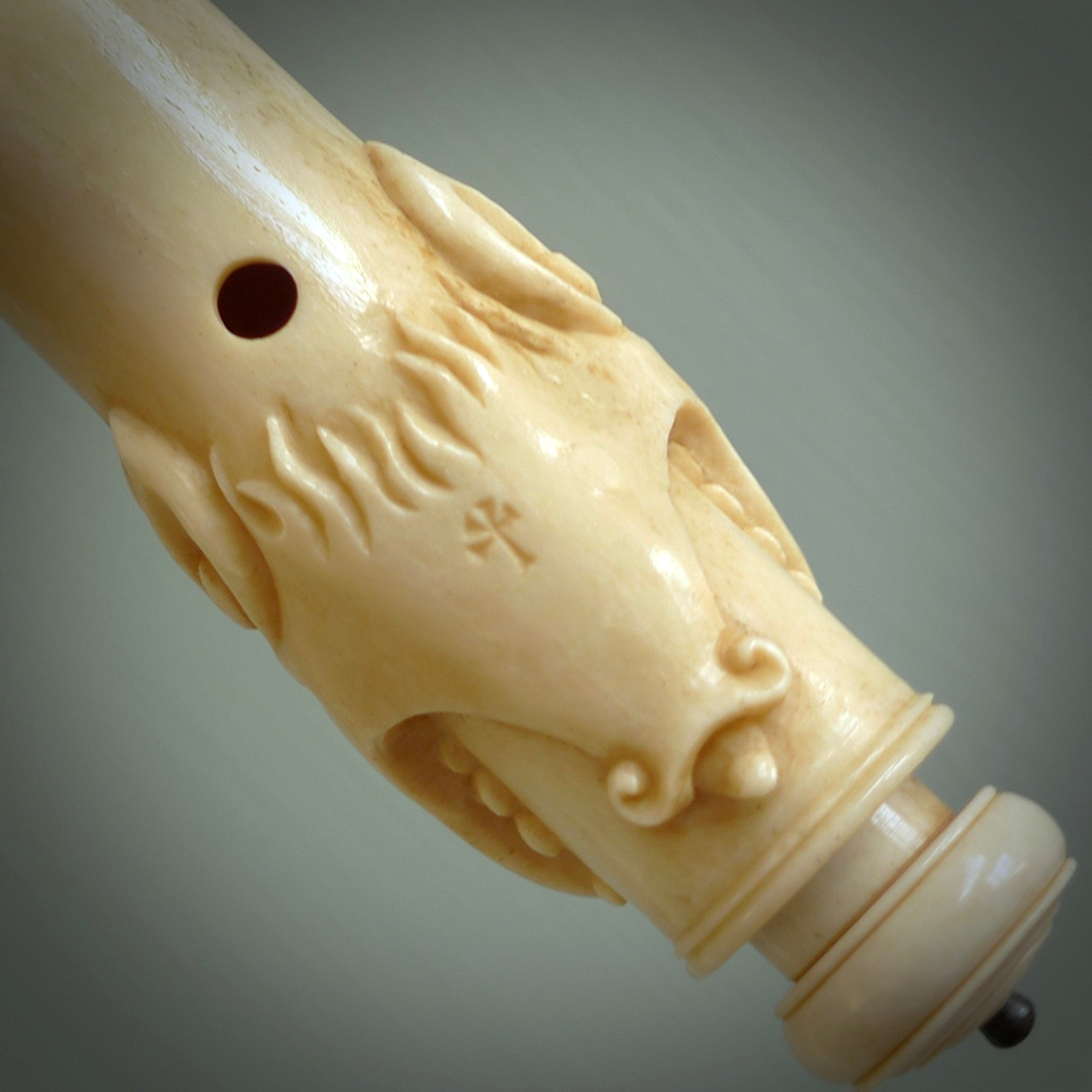 A contemporary hand carved flute. This piece is made from bone and is a fully functioning musical instrument and can be played. Beautiful art hand made by Yuri Terenyi. Flute with Dragons head.