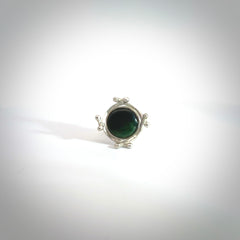 This is a handcrafted New Zealand Pounamu, Jade and sterling silver ring. This is a solid little work of art. We ship this worldwide for free and are happy to answer any questions that you may have about these or other products on our website. Delivered with Express courier and packaged in a woven kete pouch.