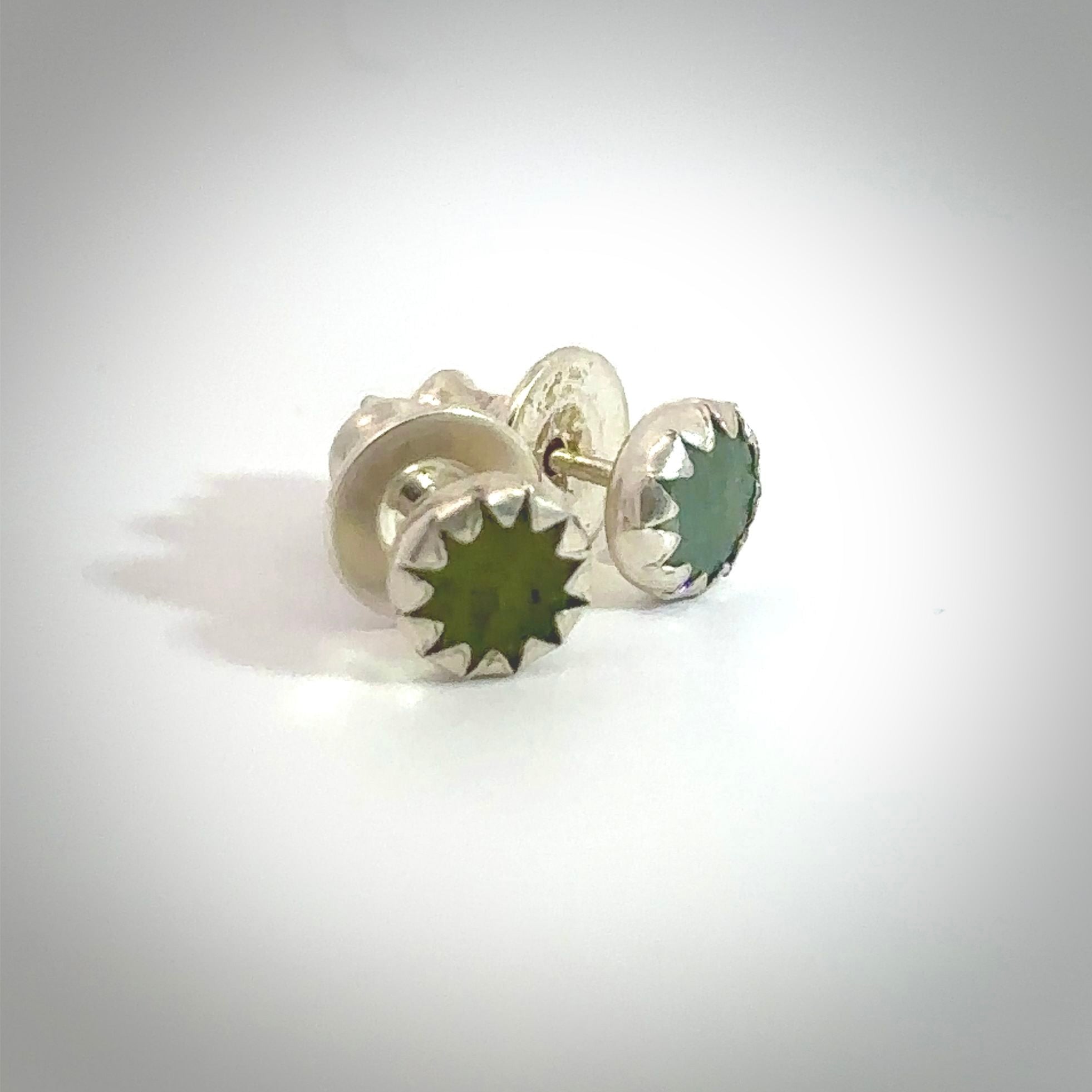 Hand carved small New Zealand Jade stud earrings. Made by NZ Pacific from NZ Garnet. Online jewellery for sale online by NZ Pacific.