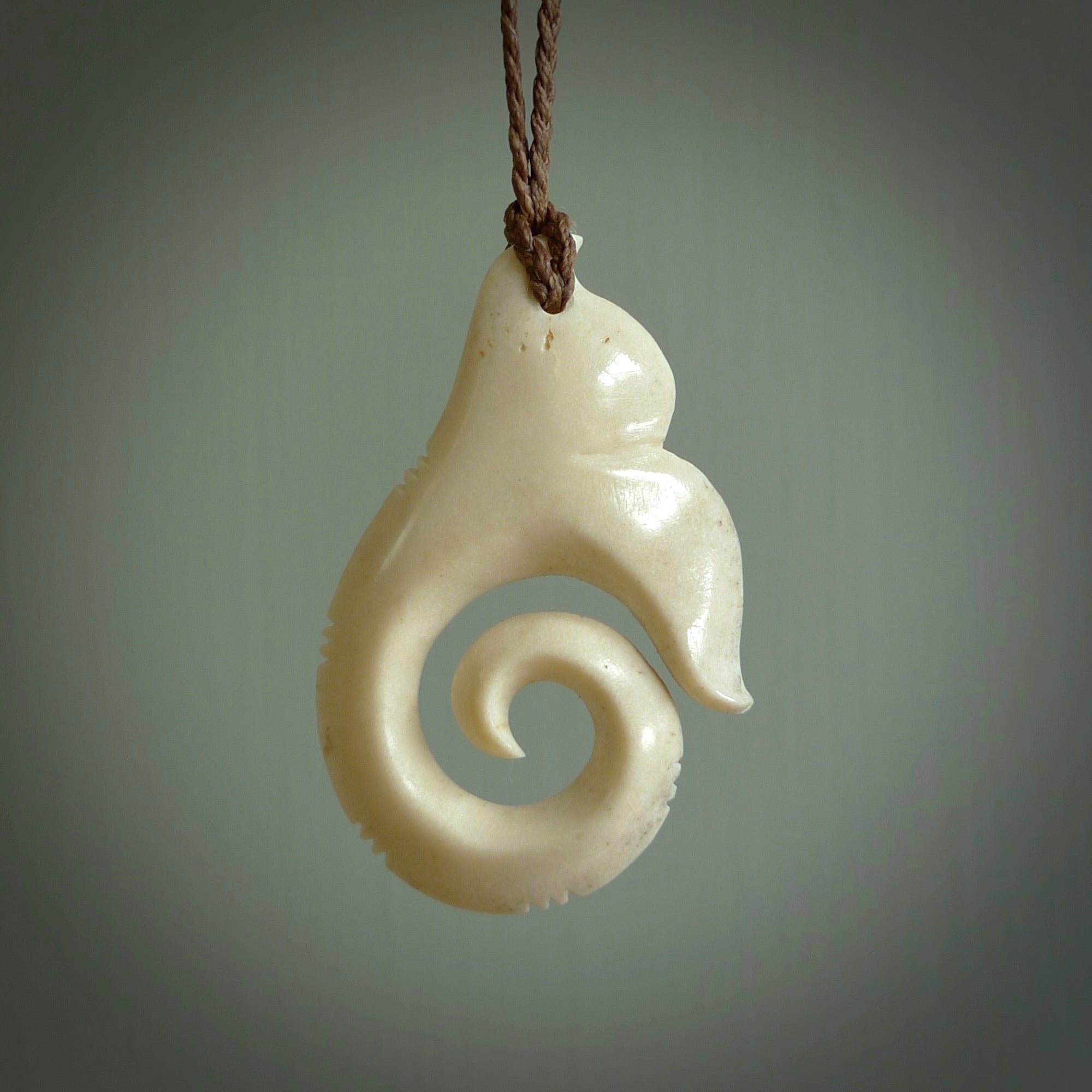 This is a wonderful, etched koru with whale tail from Deer Antler. Hand carved by Anthony Bray-Heta. Order yours now on NZ Pacific at www.nzpacific.com