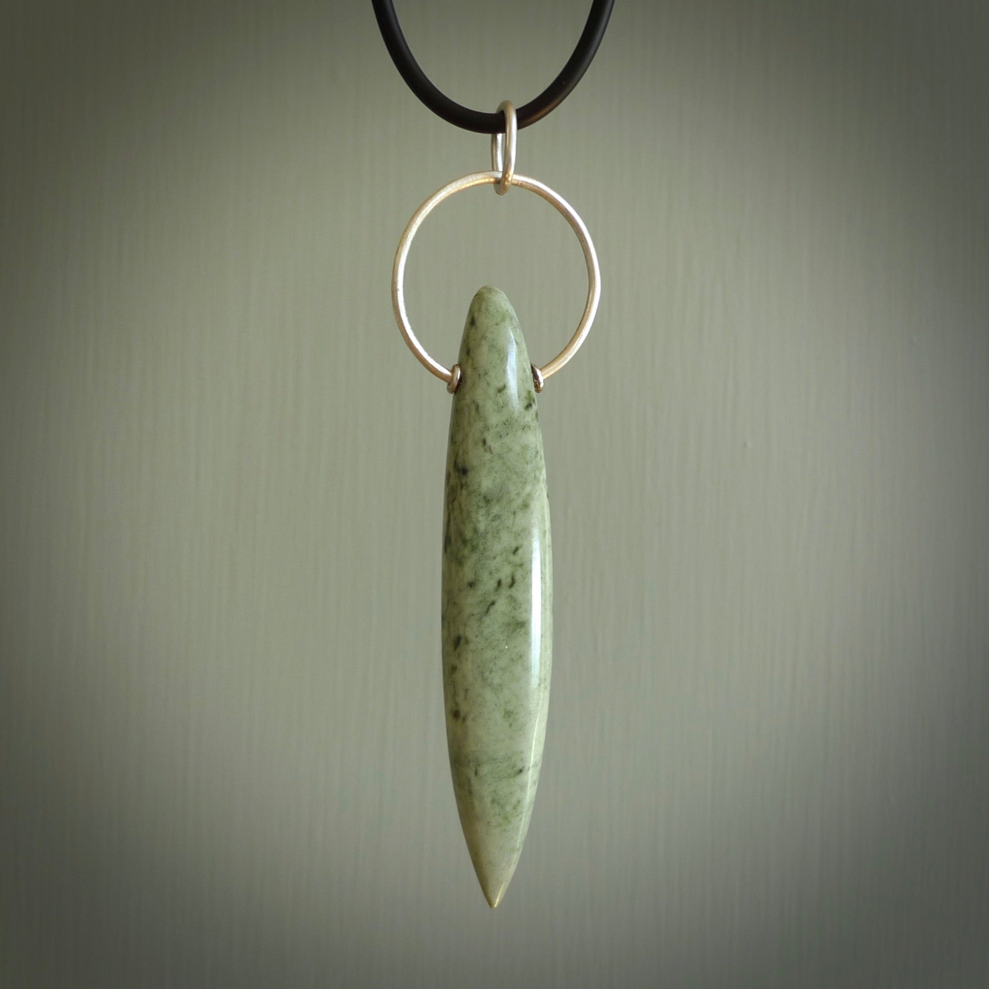 A photo of a New Zealand Jade drop pendant with sterling silver. This is a stylish statement piece - hand crafted here in New Zealand by Ana Krakosky. Unique Art to Wear. Gifts for all lovers of hand made Art to Wear.