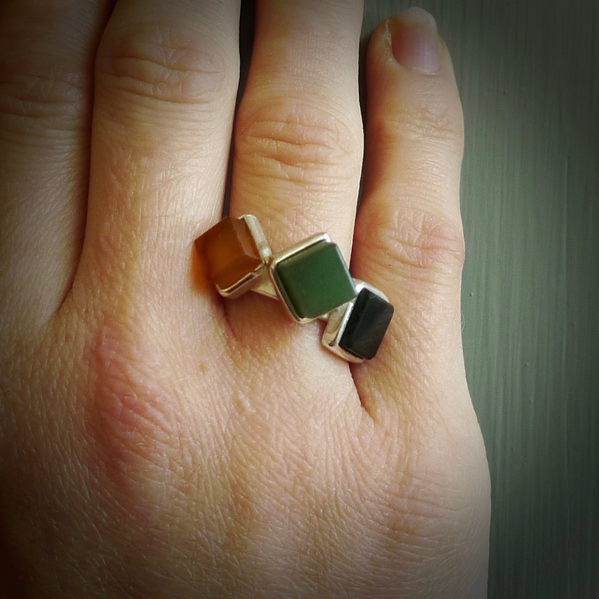 This is a handcrafted New Zealand Pounamu, Jade with Chalcedony and sterling silver ring. This is a solid little work of art. We ship this worldwide for free and are happy to answer any questions that you may have about these or other products on our website. Delivered with Express Courier in a woven kete pouch.