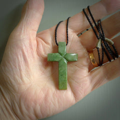 Hand carved New Zealand jade cross necklace. Religious symbol pendant. Christian cross pendant for sale online. Hand crafted from New Zealand Jade Pounamu, free worldwide delivery.