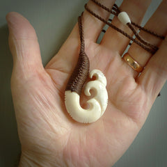 This is a wonderful, etched koru from Deer Antler. Hand carved by Anthony Bray-Heta. Order yours now on NZ Pacific at www.nzpacific.com