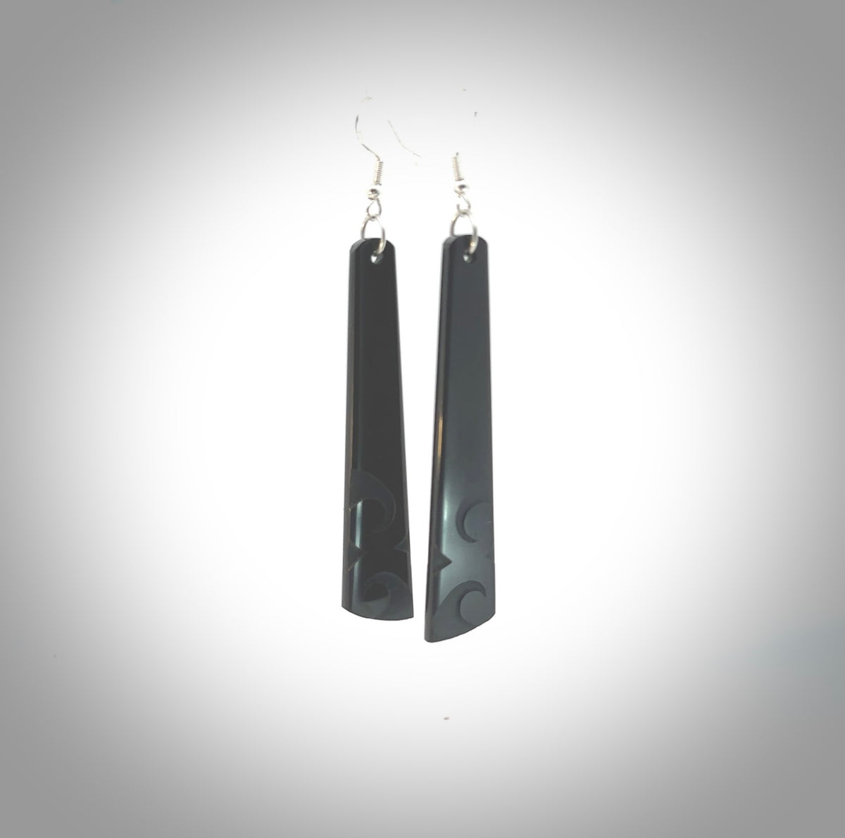 Hand carved by Rueben Tipene, these lovely large Argillite Stone drop earrings are hand made and an absolute delight. One pair only, postage is included in the price.