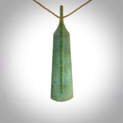 A hand carved large New Zealand Jade feather necklace. The cord is a tan colour and is a fixed length. A large sized hand made Jade feather necklace by New Zealand artist Kerry Thompson. One off work of art to wear.