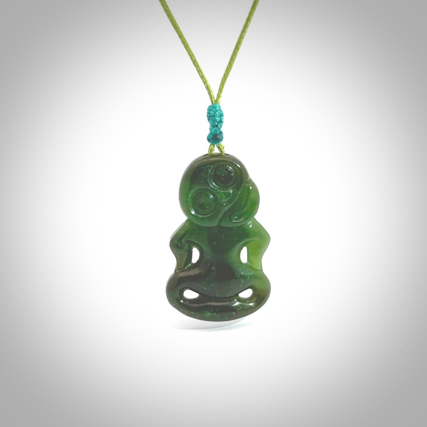 This pendant is a small jade tiki pendant. The carving shows wonderful detail on the front while the back is beautifully rounded. These are carved in Columbian Jade. The cord is adjustable in length. Provided in a woven kete pouch and shipped worldwide.