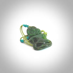 This pendant is a small jade tiki pendant. The carving shows wonderful detail on the front while the back is beautifully rounded. These are carved in Columbian Jade. The cord is adjustable in length. Provided in a woven kete pouch and shipped worldwide.