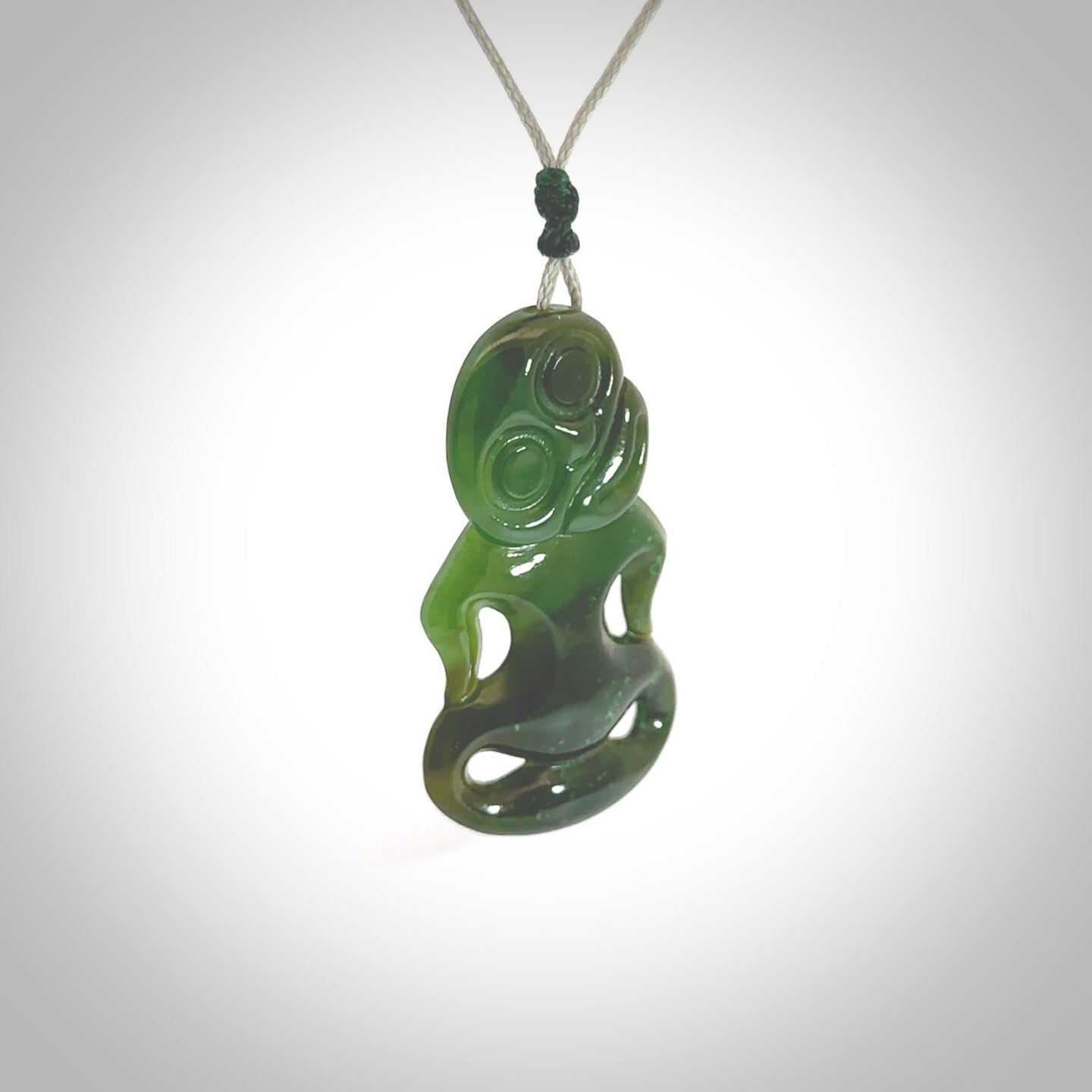 This pendant is a small jade tiki pendant. The carving shows wonderful detail on the front while the back is beautifully rounded. These are carved in Columbian Jade. The cord is adjustable in length. Provided in a woven kete pouch and shipped worldwide.