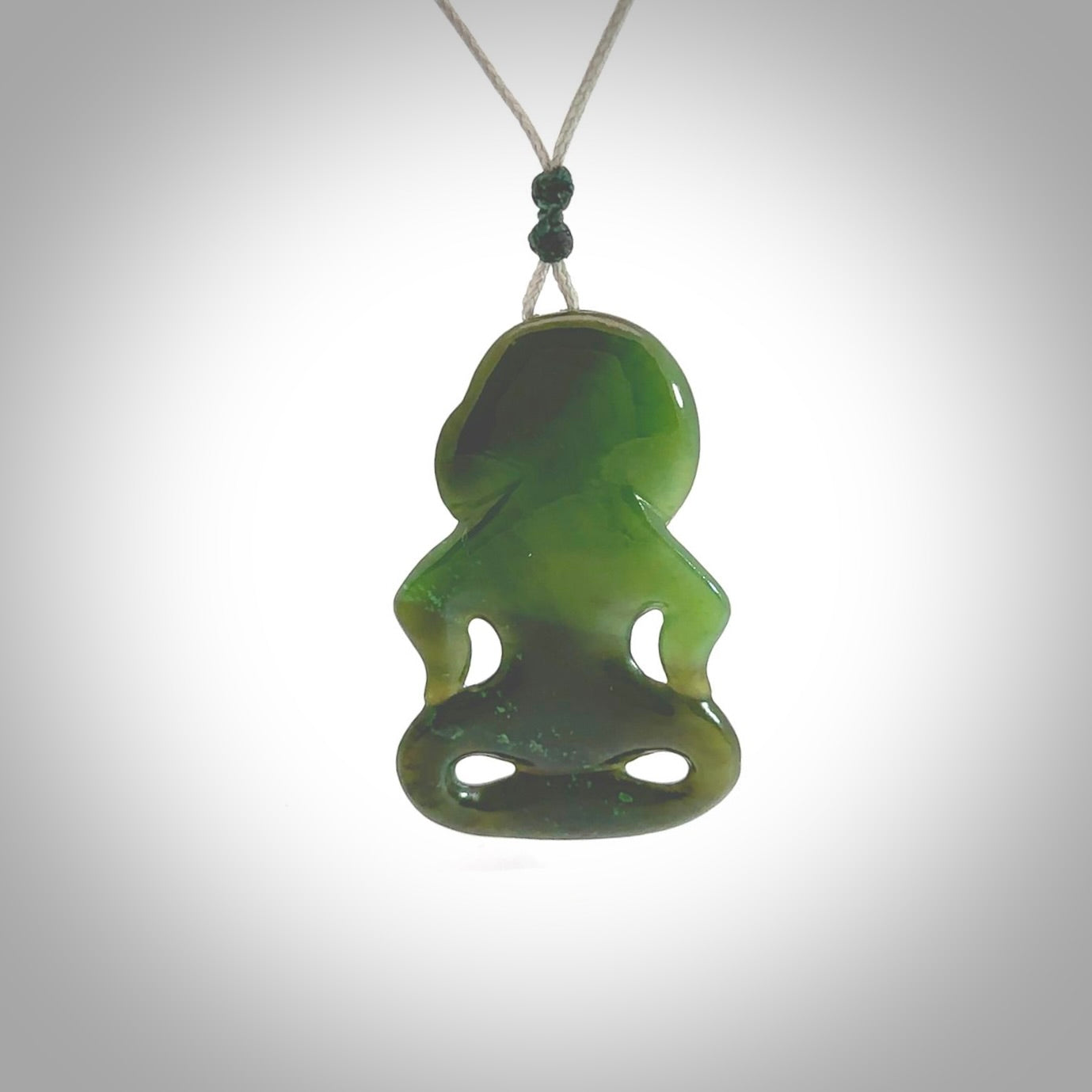 This pendant is a small jade tiki pendant. The carving shows wonderful detail on the front while the back is beautifully rounded. These are carved in Columbian Jade. The cord is adjustable in length. Provided in a woven kete pouch and shipped worldwide.