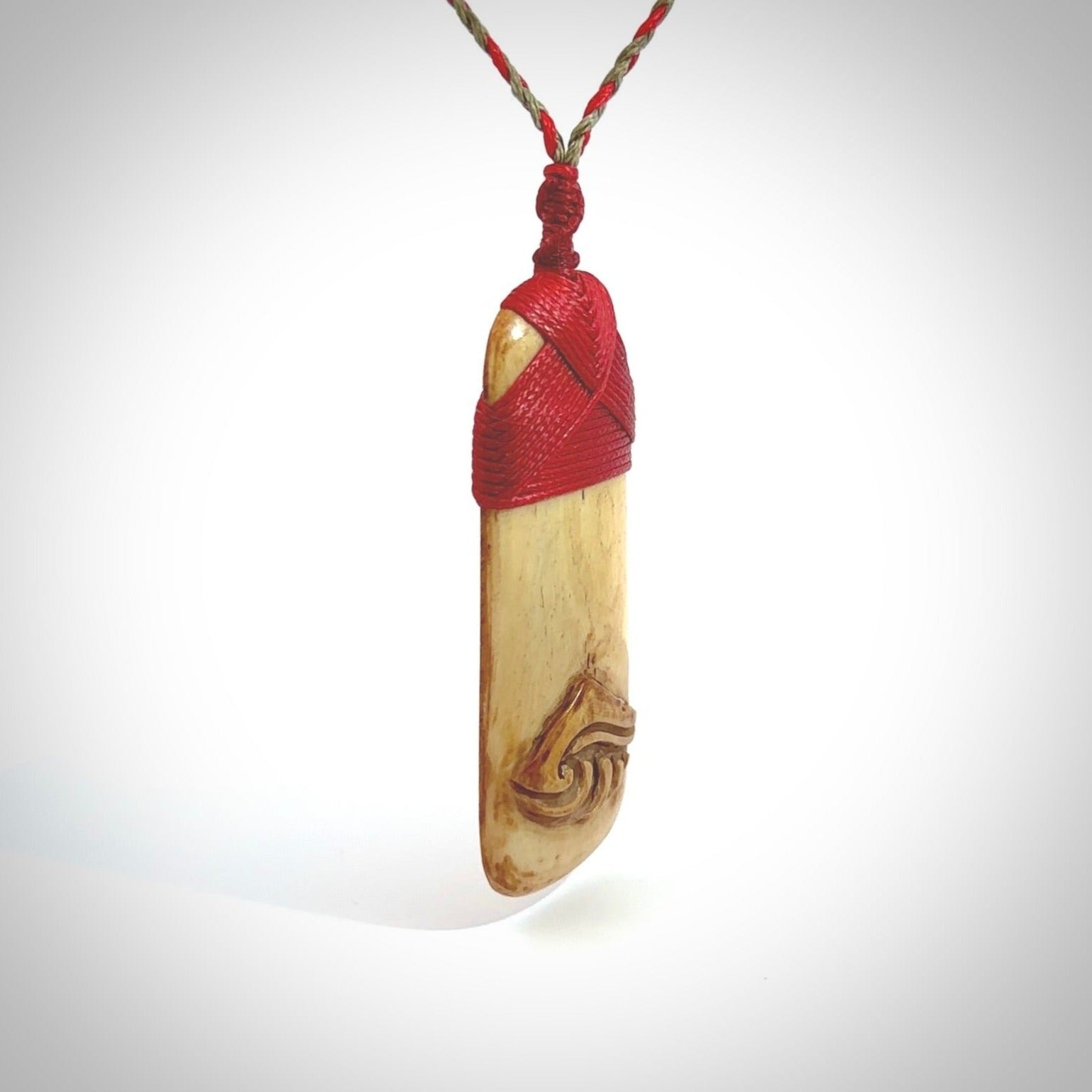 A hand carved deer antler toki with NZ Pacific logo engraving. These have been stained with our home made tea dye. Unique hand made jewellery from New Zealand Pacific.