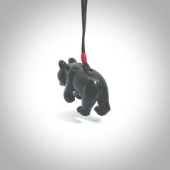 This picture shows a pendant that we designed in black jade. It is a little black bear that has a walking stance and is carved in detail. A really attractive and eye-catching piece of handmade jewellery. The cord is hand plaited braid in black and pale honey and the length can be adjusted.