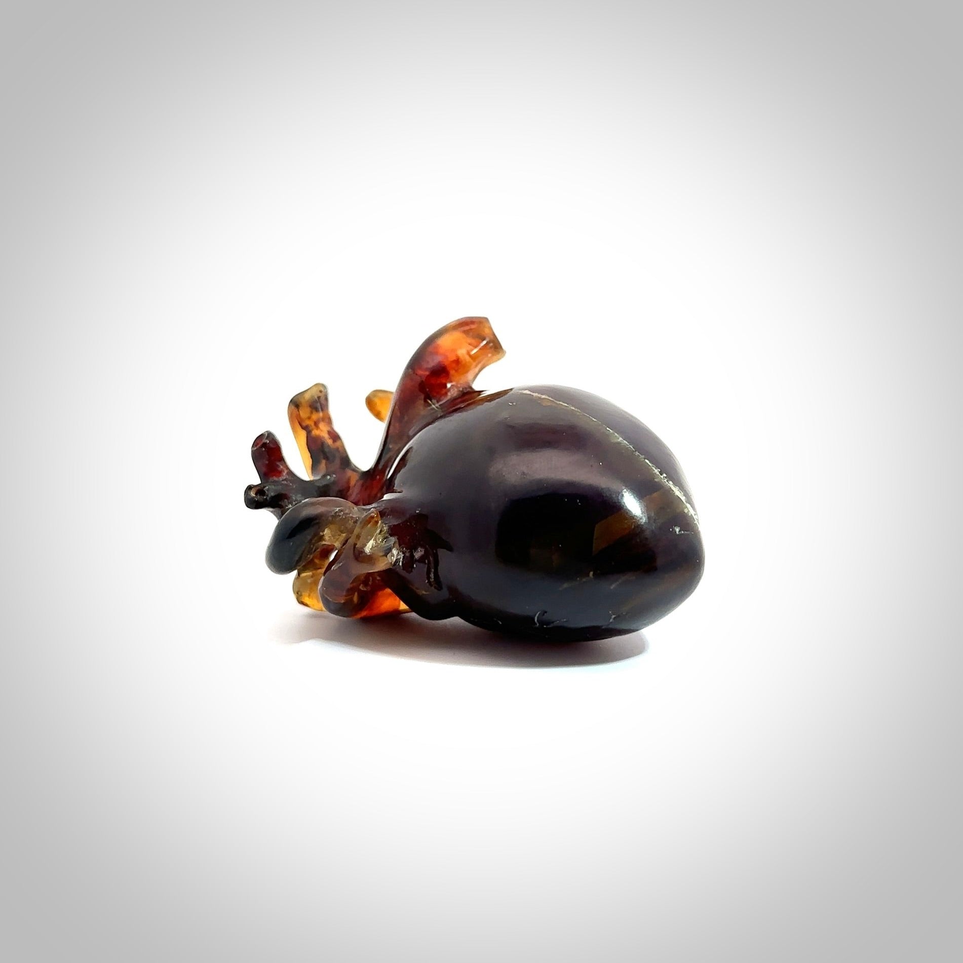 This pendant is handcrafted from rare Amber. It replicates a human heart. It is a graceful and very interesting piece that will attract admiration and comment. Free Express Shipping.