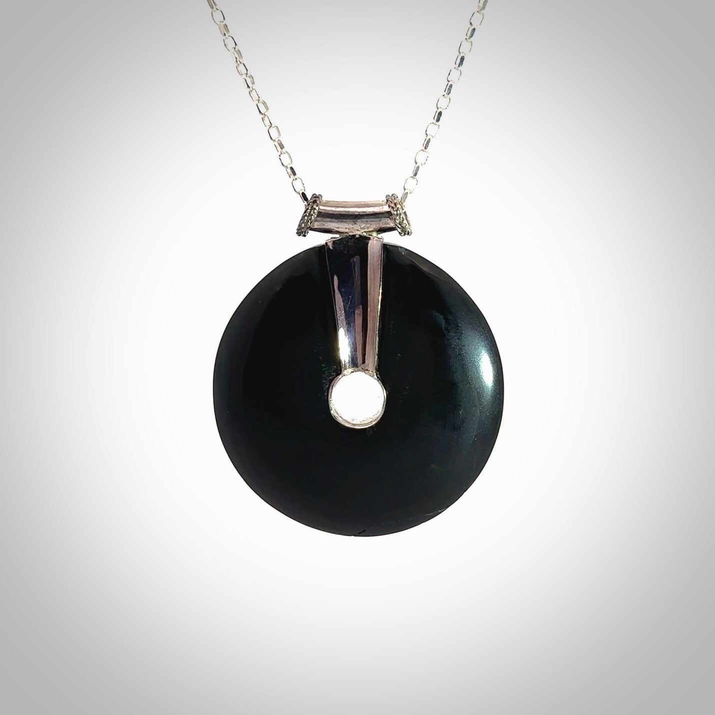 Hand crafted Australian Black jade drop necklace. This piece has a sterling silver centre and chain. This necklace is provided with a sterling silver chain.