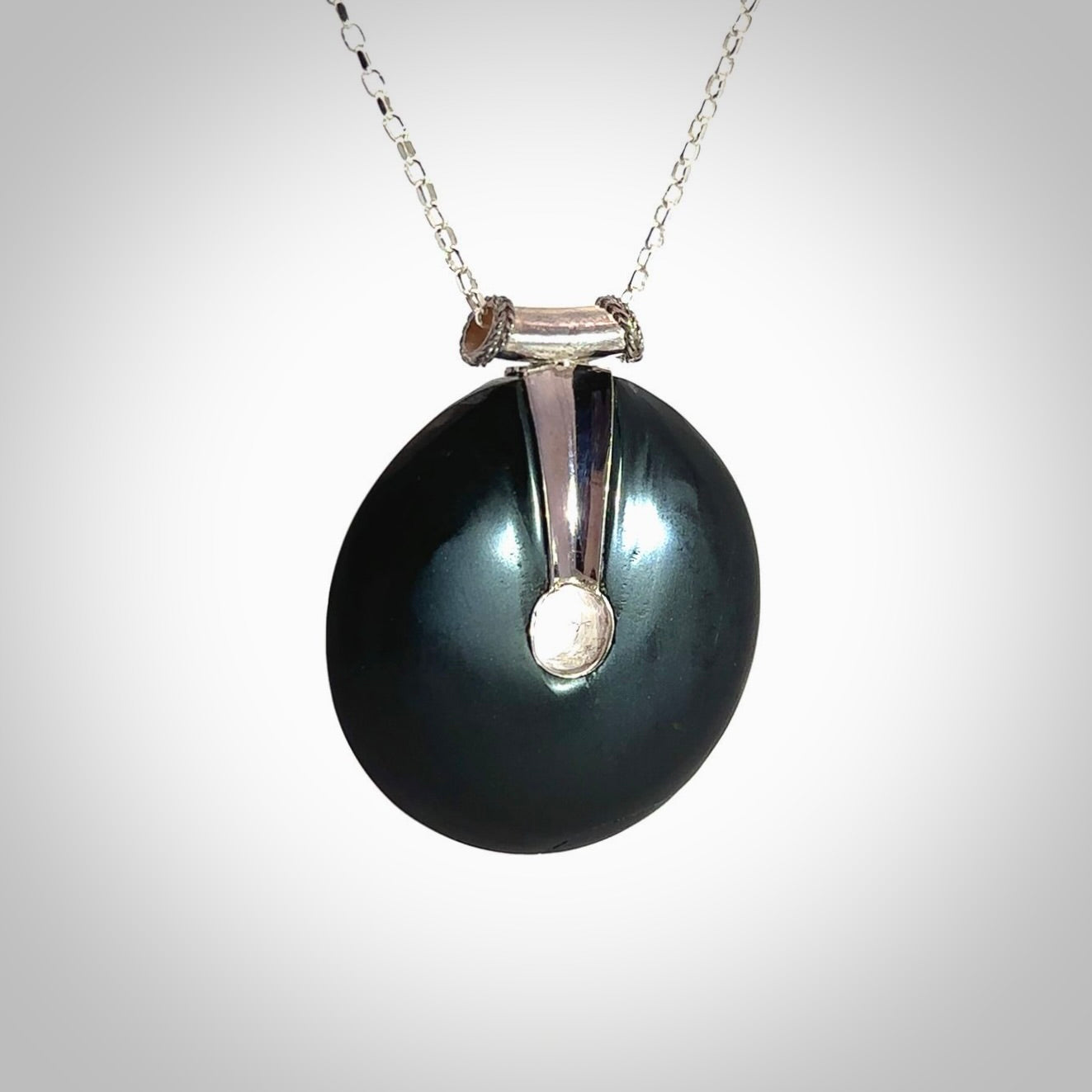 Hand crafted Australian Black jade drop necklace. This piece has a sterling silver centre and chain. This necklace is provided with a sterling silver chain.