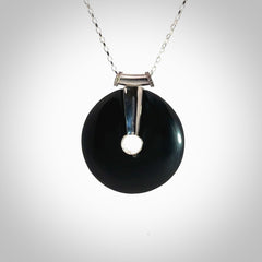 Hand crafted Australian Black jade drop necklace. This piece has a sterling silver centre and chain. This necklace is provided with a sterling silver chain.