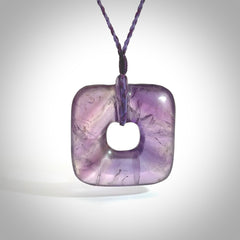 Hand carved Amethyst Crystal contemporary pendant. Carved by NZ Pacific in Amethyst Crystal. This is a modern, contemporary pendant made from natural materials.