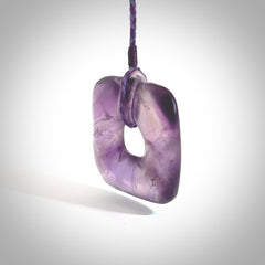 Hand carved Amethyst Crystal contemporary pendant. Carved by NZ Pacific in Amethyst Crystal. This is a modern, contemporary pendant made from natural materials.