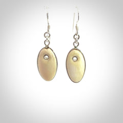 Hand carved woolly mammoth tusk earrings. Hand made by NZ Pacific for sale online.