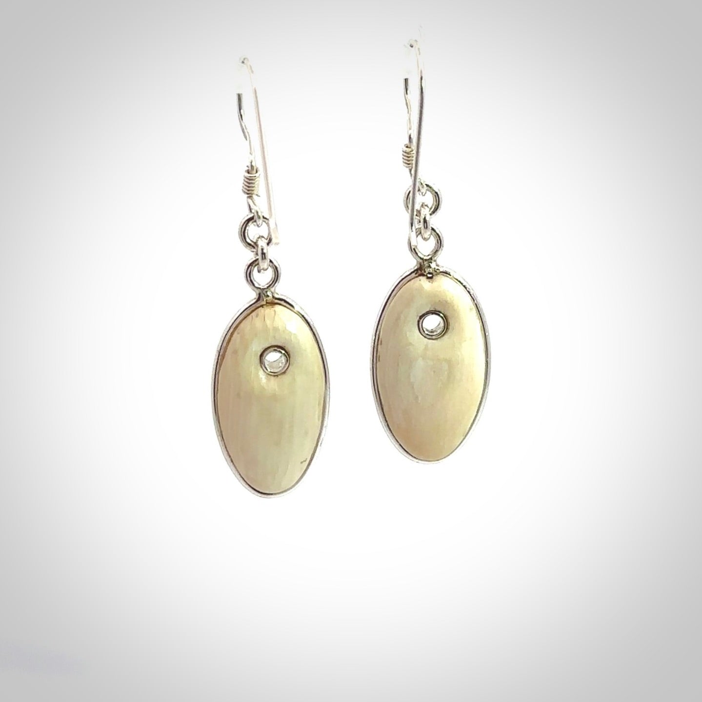 Hand carved woolly mammoth tusk earrings. Hand made by NZ Pacific for sale online.