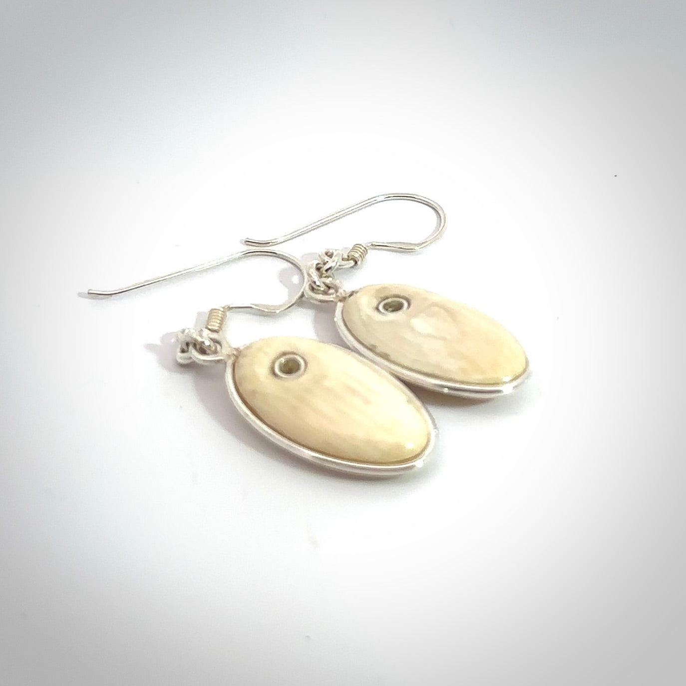 Hand carved woolly mammoth tusk earrings. Hand made by NZ Pacific for sale online.