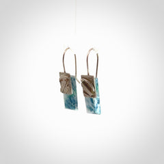 These are a pair of beautiful Aotea Stone and sterling silver earrings. It is carved from Aotea Stone from New Zealand. It is a light blue and white colour with sterling silver. Hand made here in New Zealand by Ana Krakosky.