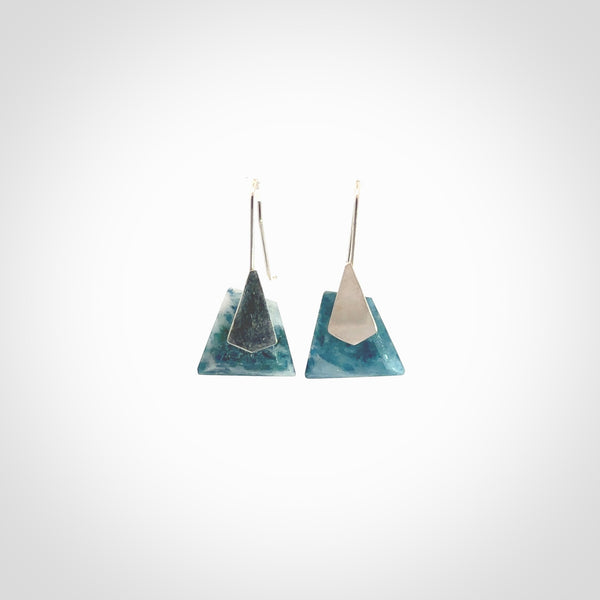 These are a pair of beautiful Aotea Stone and sterling silver earrings. It is carved from Aotea Stone from New Zealand. It is a light blue and white colour with sterling silver. Hand made here in New Zealand by Ana Krakosky.